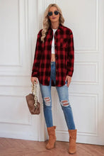Red and black plaid flannel shirt with button-down closure and sleeve length