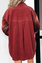 Red corduroy oversized coat with patchwork sleeves and button closure
