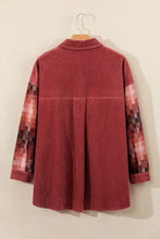 Medium red corduroy shirt jacket with pixelated patchwork sleeves