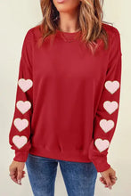 Women’s red long-sleeve heart round neck dropped shoulder sweatshirt with pink heart appliques