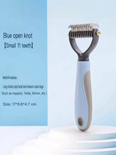 Light blue gray plastic pet grooming rake with 11 teeth reduces pet hair