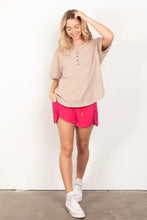 Relaxed fit beige henley shirt with patch pocket and twisted sleeve band