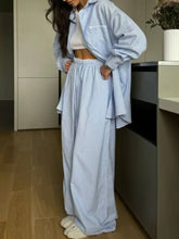 Light blue striped cotton pajama pants with elastic waistband