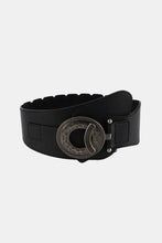 Retro elastic wide belt in black leather with ornate silver buckle