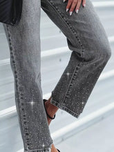 Grey denim rhinestone embellished cropped jeans with sparkling rhinestone detailing along outer leg and hem