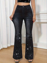 Black flare leg jeans with rhinestone embellished flare detailing featuring sparkling star embellishments