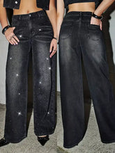 Black rhinestone embellished wide leg jeans with sparkling star embellishments on denim fabric