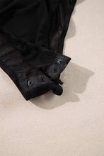 Black lace rhinestone long sleeve bodysuit with snap closures at the leg opening for an elegant fit