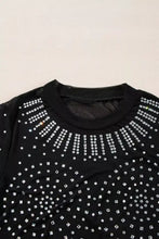 Black mesh long sleeve bodysuit with silver rhinestones in a radiant sunburst pattern on chest and shoulders