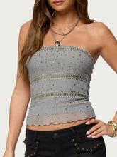 Gray rhinestone tube top with silver studs and gold-toned metallic trim in a strapless design