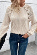 Women’s beige ribbed knit round neck sweater with decorative buttons on shoulders