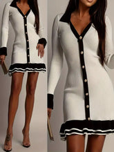 Ribbed knit contrast trim sweater dress with white fabric, black trim, ruffles, gold buttons