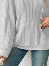 Light gray ribbed knit long sleeve drawstring hoodie with front pocket in stretchy material machine wash cold