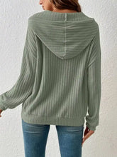 Ribbed knit long sleeve hoodie in soft olive green ribbed fabric with a relaxed fit suitable for machine wash cold care
