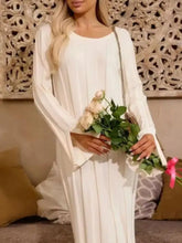 Ribbed knit slit sweater dress: flowing white long-sleeved pleated gown