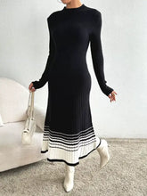 Black ribbed knit sweater midi dress with striped flared hem