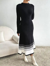 Black ribbed knit midi sweater dress with white striped hem