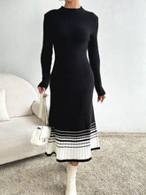 Black ribbed knit midi sweater dress with white striped hem
