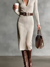 Cream ribbed knit midi dress with deep V-neck, long sleeves, brown belt