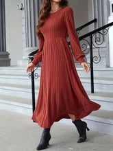 Rust-colored ribbed long sleeve sweater dress, high neckline, midi length