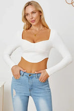 White ribbed long sleeve crop top with sweetheart neck and curved hem
