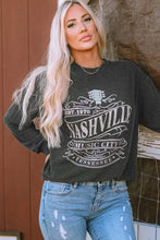 Woman in ribbed round neck long sleeve graphic sweatshirt