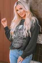Black ribbed round neck long sleeve graphic sweatshirt with Nashville Music City Tennessee print