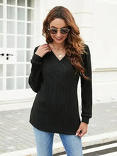 Women’s ribbed surplice long sleeve black V-neck wrap top