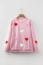 Ribbed texture chenille long sleeve pink striped sweatshirt with red pink and white heart glitter trim patches