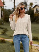 Women’s cream-colored highly stretchy ribbed V-neck long sleeve tee