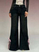 Black classic denim flare jeans with pink ribbon ties at cuffs for a perfect fit and stylish detail
