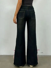 Dark wash classic denim flare jeans with pink ribbon ties at cuffs for a stylish perfect fit look