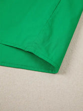 Vibrant green ricrac trim color block patchwork short sleeve blouse with neat stitching along the hem