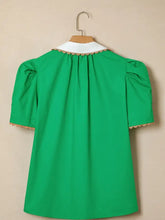 A vibrant green ricrac trim color block patchwork short sleeve blouse with white shirt collar and beige scalloped trim