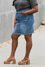 Risen amelia mid-rise denim mini skirt in blue with frayed hem and distressed details