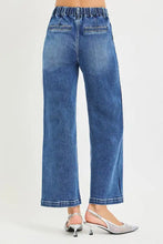 Blue denim risen jeans with elastic band high rise cropped wide-leg jeans featuring subtle fading in classic denim