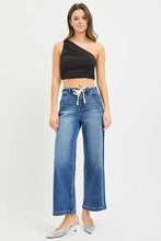 High-waisted risen jeans in classic denim with wide-leg cropped cut and white drawstring elastic waistband