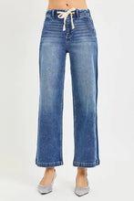 High-waisted risen jeans in classic blue denim with a drawstring waistband and wide-leg cropped design