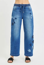 Blue denim cropped barrel jeans with risen elastic band waistband and star patch appliqués for casual wear