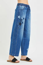 Blue denim cropped barrel pants with star patch details and risen elastic band waistband with drawstring closure