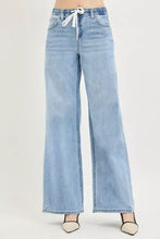 Light-wash denim risen elastic band slouchy wide jeans with white drawstring waistband and wide leg design