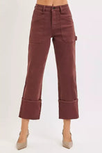 Maroon high rise wide cargo pants with rolled cuffs and multiple pockets in plus size full size design
