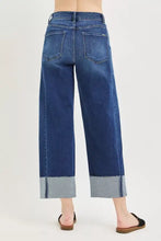 Dark blue denim RISEN full size slouchy crop barrel leg jeans with wide leg cut and rolled lighter fabric cuffs