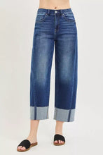 Blue denim RISEN full size slouchy crop plus size jeans with high waist barrel leg and rolled cuffs showing lighter fabric