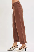 Brown high-rise wide-leg barrel baggy jeans with tummy control mid rise and rolled cuffs classic denim construction