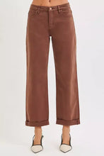 Brown wide-leg denim trousers with rolled cuffs featuring tummy control mid rise and barrel baggy fit for plus size