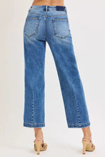 Risen high rise crop boyfriend tapered jeans in medium blue wash denim with straight-leg cut and frayed cuffs