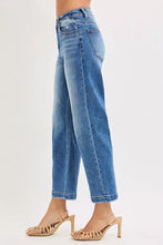 Risen high rise crop boyfriend tapered jeans in high waisted medium blue wash denim with faded wash and rolled cuffs