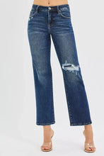 Risen high rise crop slim straight medium-wash blue denim jeans with distressed ripped knee and hidden knee patch