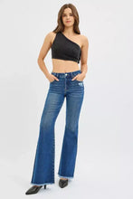 Blue denim risen high rise flare jeans with frayed hem and distressed details in a high rise flare style